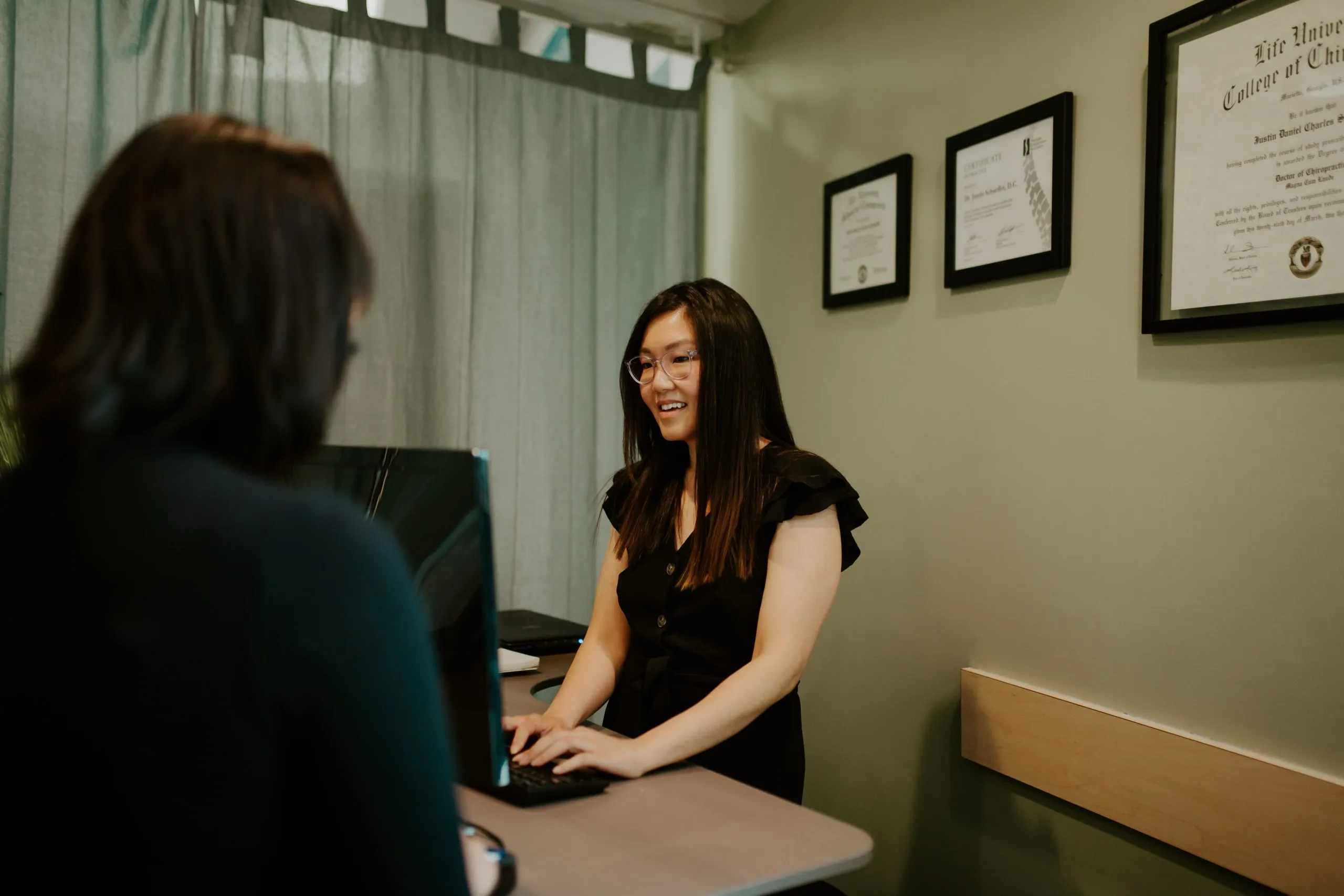 Receptionist helping a client